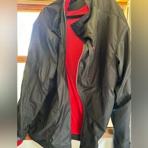 Jordan brand light coat.  Black and Red with Gold Jumpman on front.